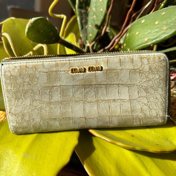 Miu Miu Handbags - MUI MUI zip around wallet. EUC. Pale Green Snake-like print on outside,